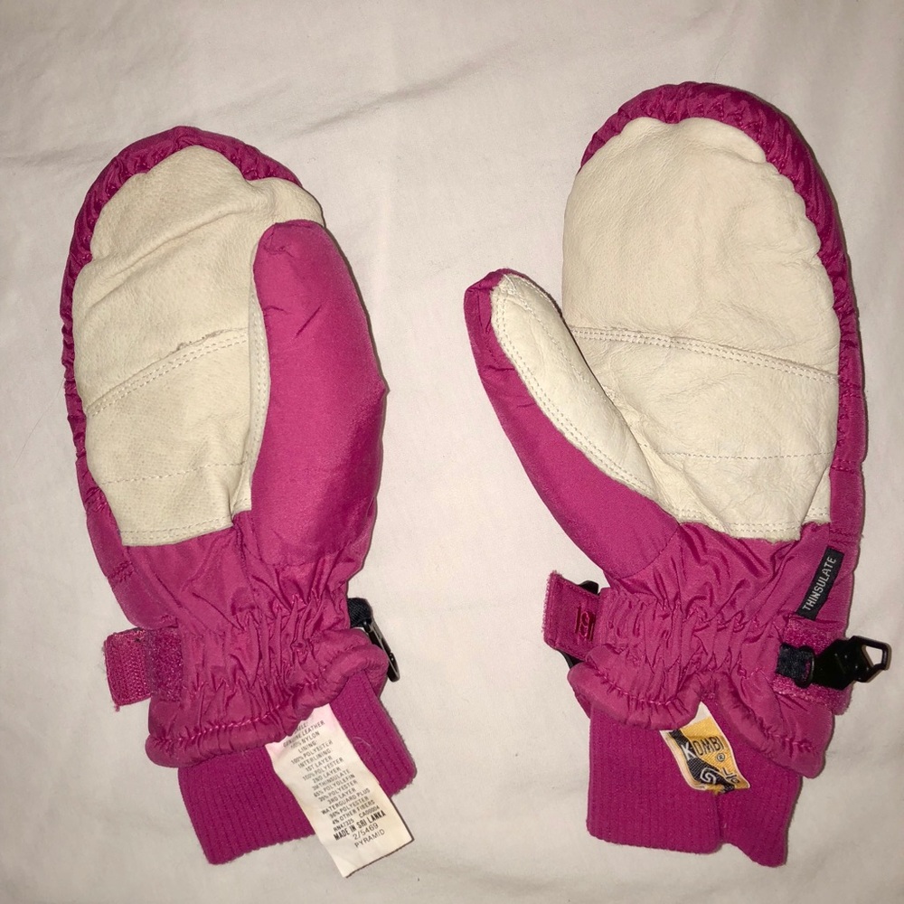 Used kombi pink mittens.